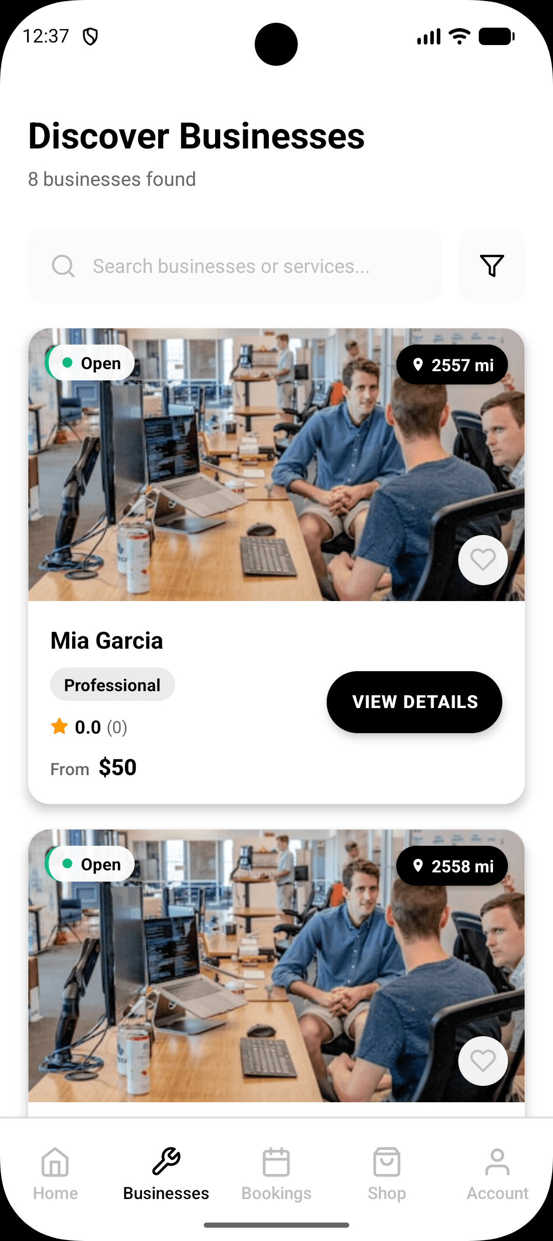 Pro Black app Discover Businesses screen listing nearby businesses with open status and distance